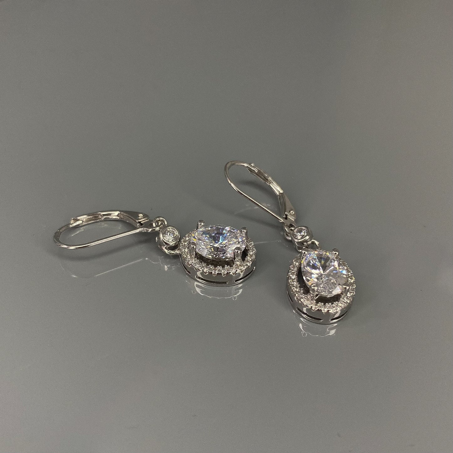 Sterling Silver Rhodium Plated Oval CZ Drop Earrings