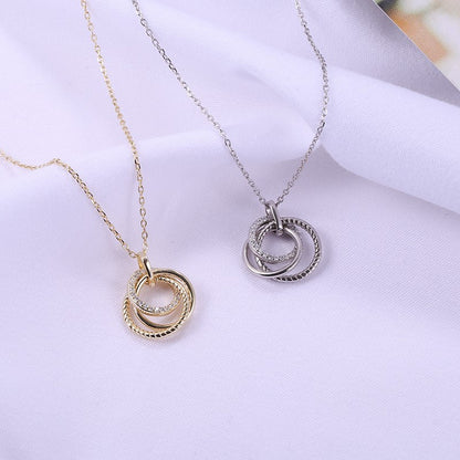 Sidabrinis paauksuotas apvalus pakabukas su cirkoniais ir grandinėle