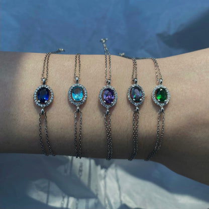 Sidabrinė rodžiuota apyrankė su ovaliu mistinio topazo akmeniu