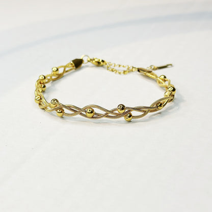 Auksuota sukta apyrankė su burbuliukais