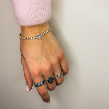 Auksuota apyrankė Tennis su ovaliu baltu cirkoniu