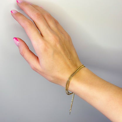 Auksuota trijų gijų apyrankė