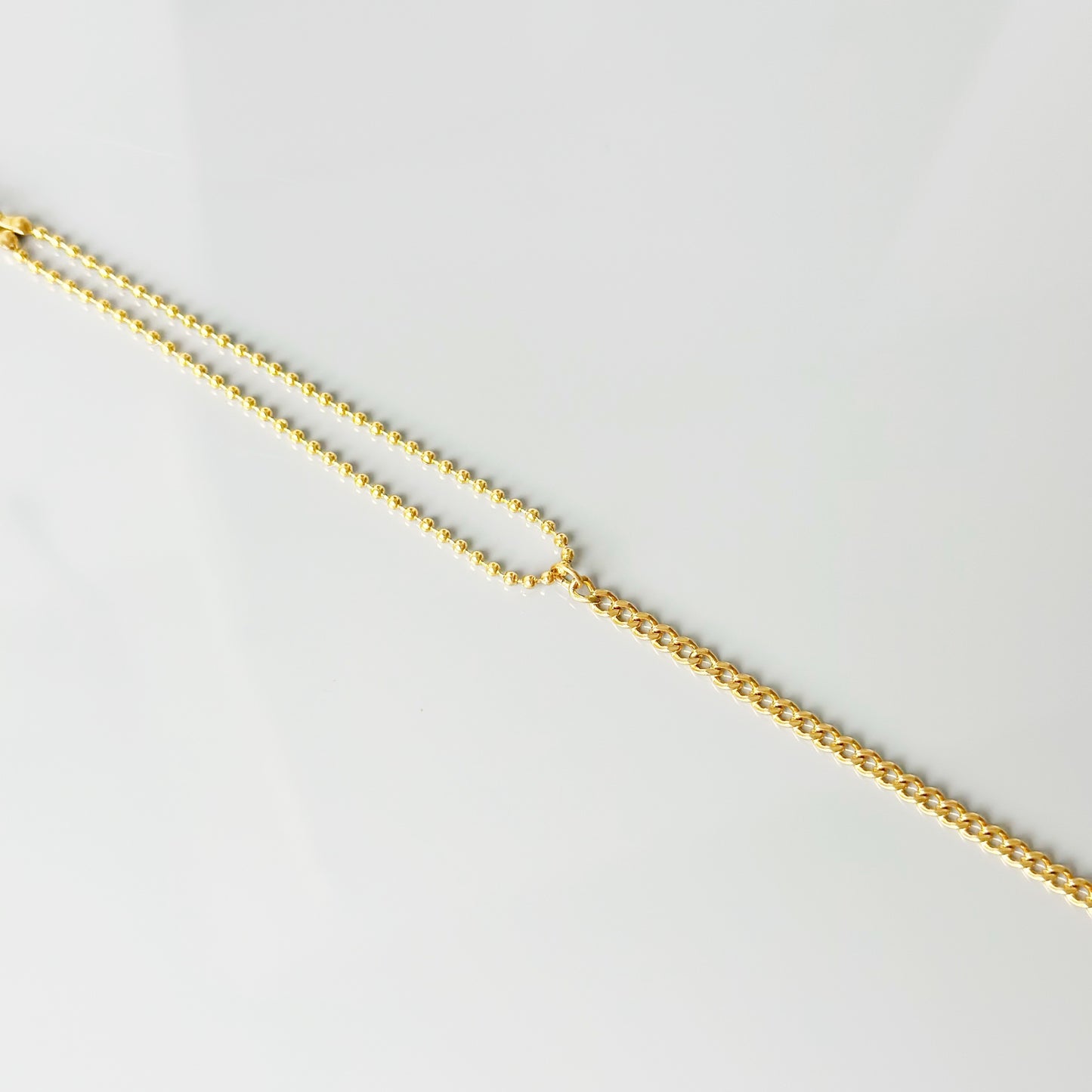 Auksuota dvigubo dizaino apyrankė „Ball Bead & Curb“