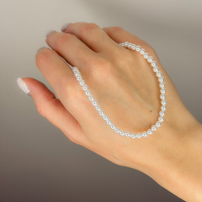 Auksuotas perlų vėrinys