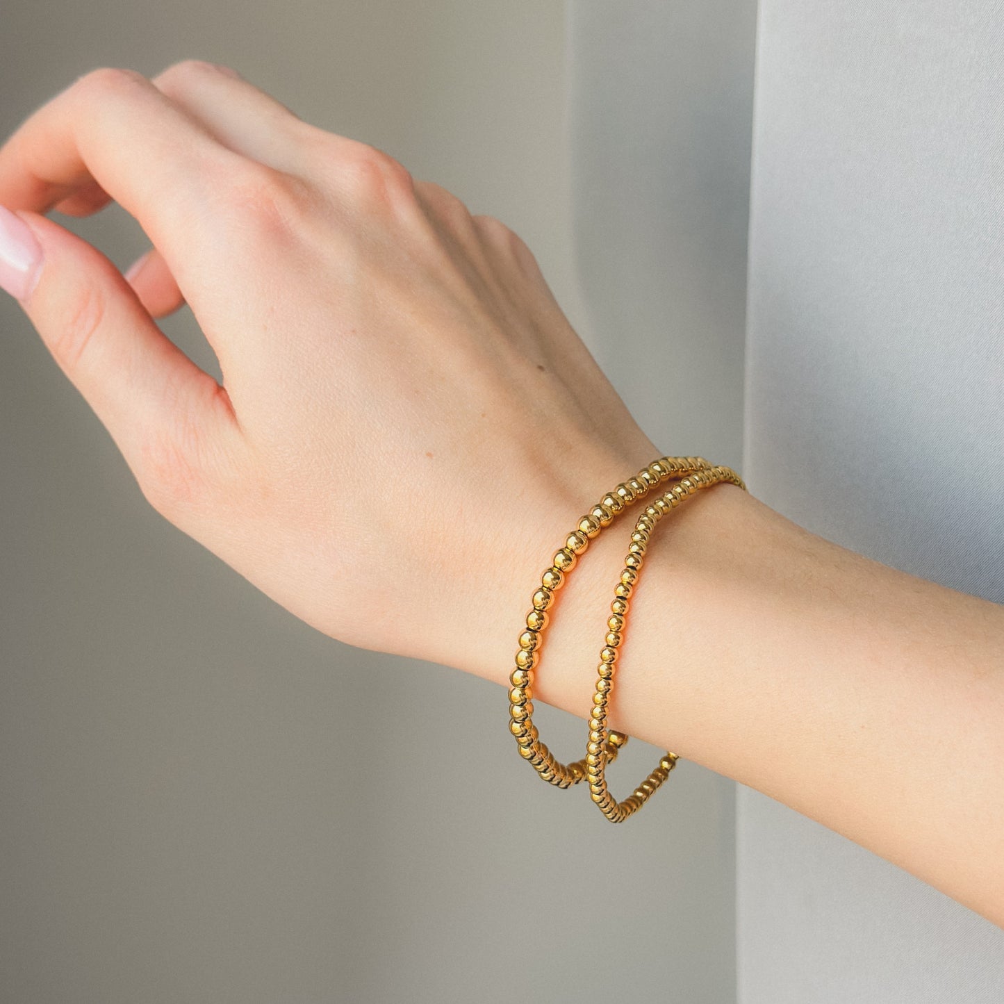 Auksuota apyrankė su burbuliukais