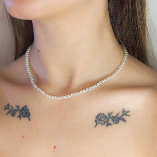 Auksuotas perlų vėrinys